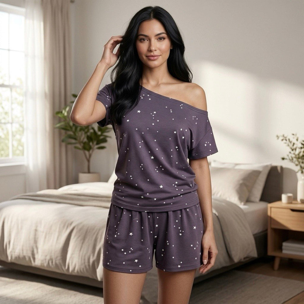 Model wearing star print cotton short pajama set standing full body cozy bedroom